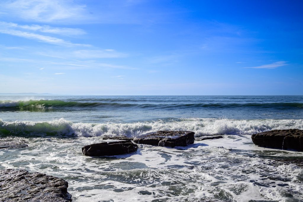 Waves break over the rocks