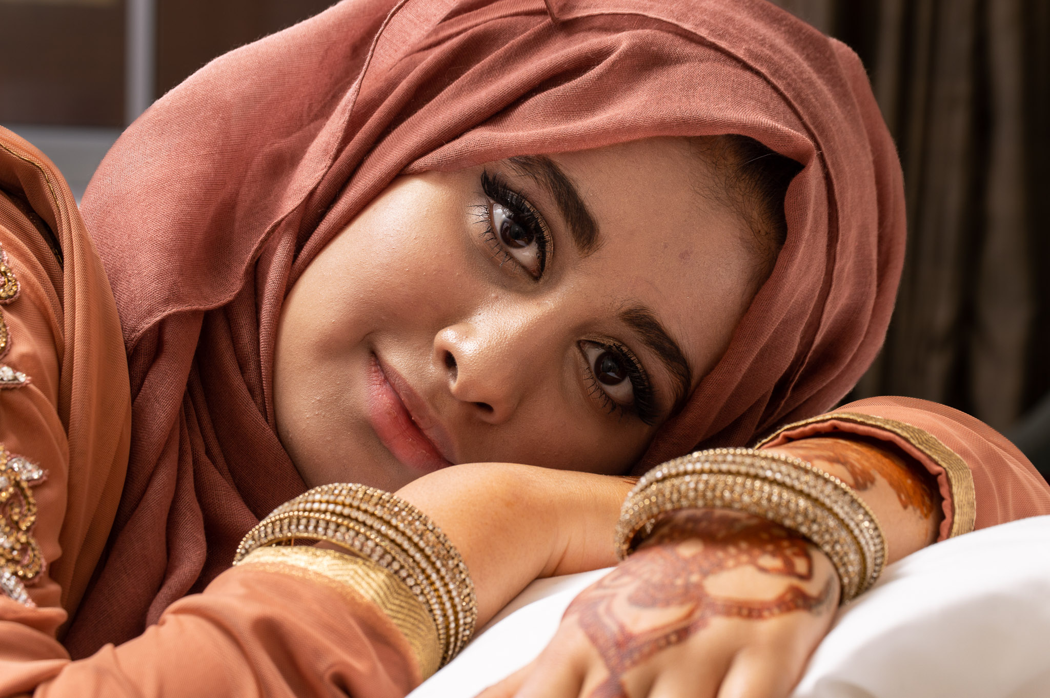A beautiful, candid close-up portrait highlighting natural details and genuine emotion in an unposed, relaxed setting
