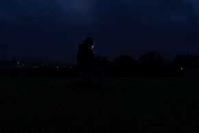 a man sits alone in the dead of night part of a project by charlie hannah documenting mental health struggles