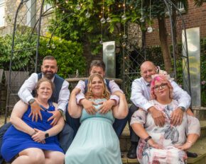 Candid relaxed portrait photography nighttime shenanigans three couples get touchy-feely with each other at a wedding. candid wedding photography by Charlie Hannah