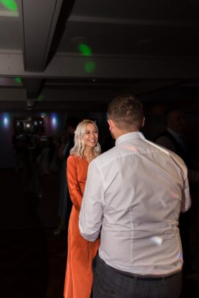 Candid wedding portrait of a couple sharing a quiet, unposed moment during the evening reception shenanigans, captured by Charlie Hannah.